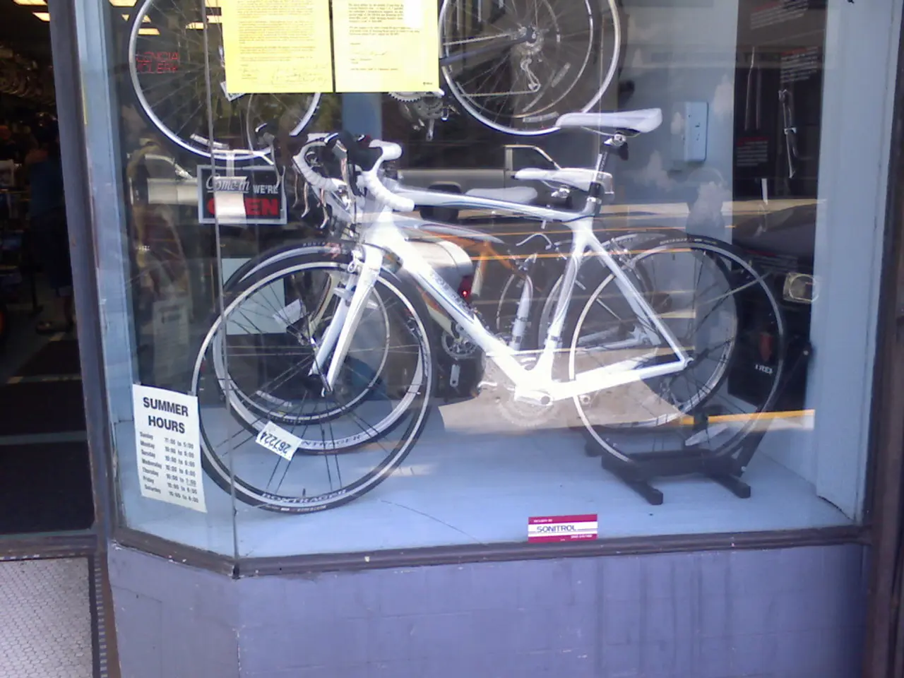 In the picture we can see some bicycles are placed in the show case which is covered with glass.