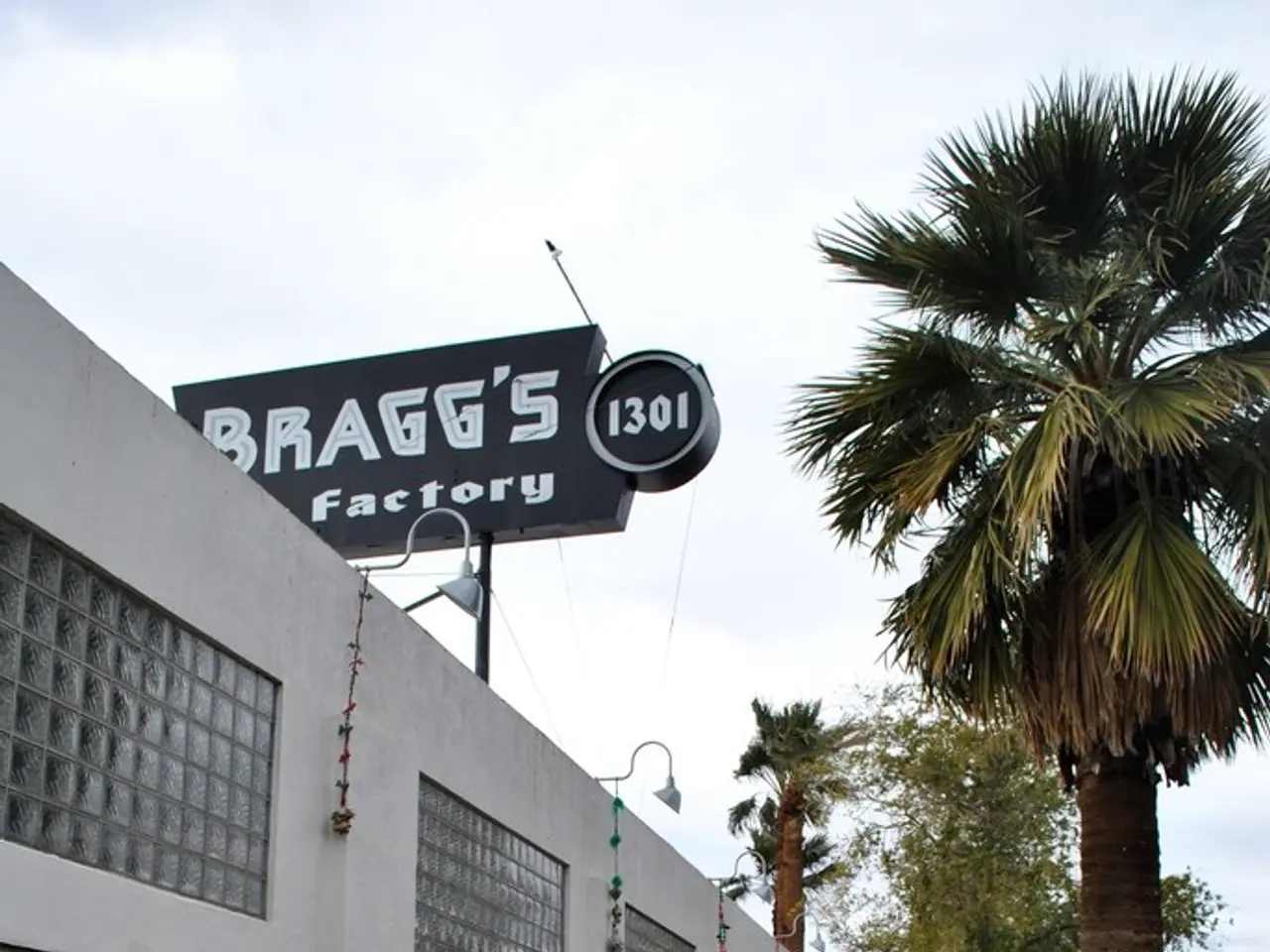 In the image we can see there are buildings and there are trees in the area. On top of the building...