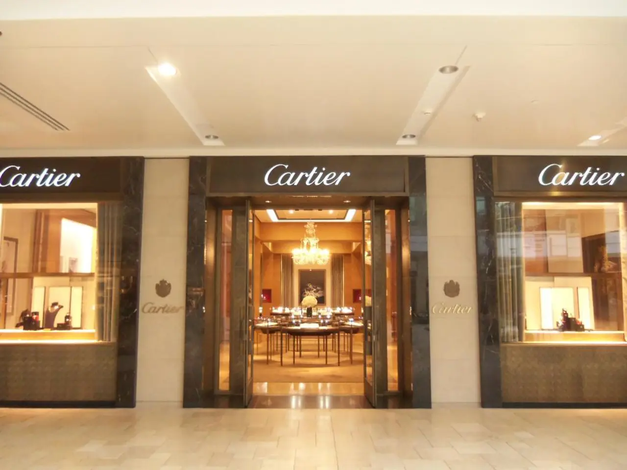 It looks like a hotel, in the middle there is a table. It is the glass door in this image.
