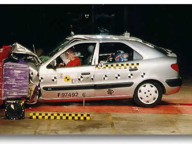 In the picture there is a scrap car and inside the car some people were sitting and the picture is...