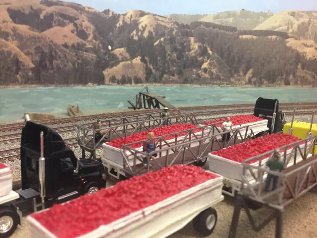 At the bottom of the image there are trucks with red color items. And also there are few men...