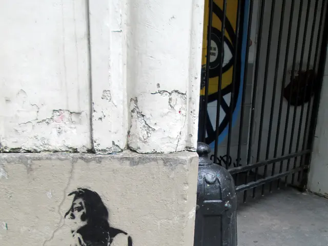 In this picture we can see a sketch on the wall. There is a gate on the right side.