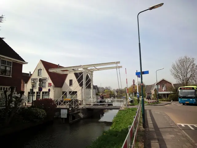 On the right side there is a road. On that there is a bus. Near to the road there are sidewalks....